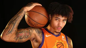 Kelly Oubre Jr Poses For The Camera Wallpaper