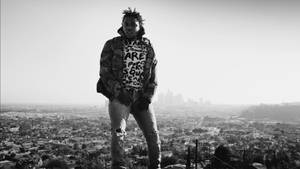 Kendrick Lamar In City Landscape Wallpaper