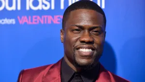 Kevin Hart In Red Suit Wallpaper