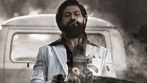 Kgf Rocky Smoking With Gun Wallpaper