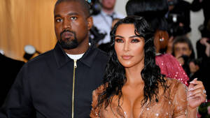 Kim Kardashian And Kanye West Pose For A Photoshoot At The Met Gala Wallpaper
