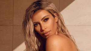Kim Kardashian Looking Beautiful In Her Portrait Wallpaper