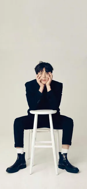 Kim Seon Ho Sitting Casually On A Chair. Wallpaper