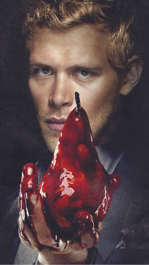 Klaus Mikaelson With A Bloody Pear Wallpaper