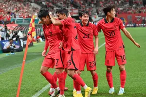 Korea Republic National Football Team Showing Off Their Skills And Unity On The Field Wallpaper