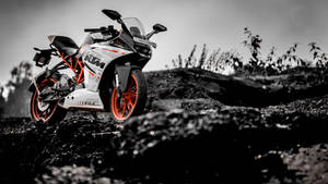 Ktm Duke 390 On Rocky Cliff Wallpaper