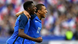 Kylian Mbappe Side-hugging Teammate Wallpaper