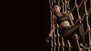 Kylie Jenner At Climbing Rope Net Wallpaper
