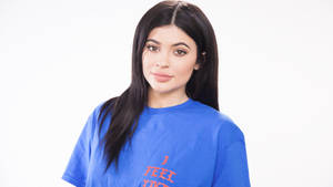 Kylie Jenner Wearing Blue Shirt Wallpaper