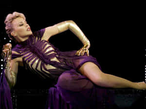 Kylie Minogue Stage Performance Purple Outfit Wallpaper