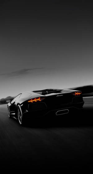 Lamborghini Iphone Black Aesthetic On Road Wallpaper