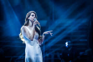 Lana Del Rey Live Performance Blue Lights Wallpaper