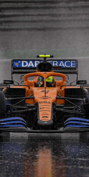 Lando Norris Racing Expertly Through The Rain Wallpaper