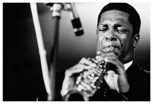 Legendary American Jazz Musician John Coltrane Playing Saxophone Wallpaper