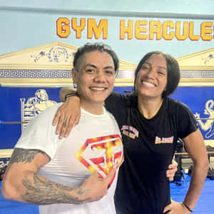 Legendary Wrestler Juventud Guerrera Posing With Wrestling Superstar Sasha Banks Wallpaper