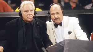 Legendary Wrestling Commentators At Desk Wallpaper