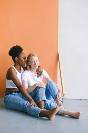 Lesbian Girl Sitting On Floor Wallpaper