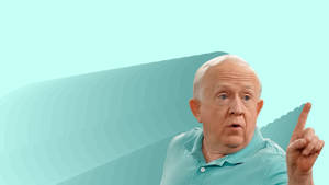 Leslie Jordan Pointing Bluegreen Background Wallpaper