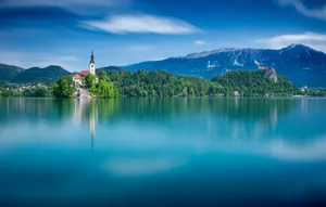 Leveled Calm Waters Of Lake Bled Wallpaper