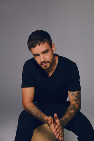 Liam Payne Getting Down With A Cool Move Wallpaper