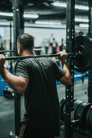 Lifting Weights In The Gym Wallpaper