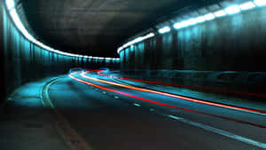 Light Trailsin Dark Tunnel Wallpaper