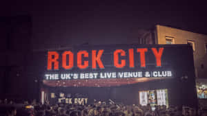 Lil Pump Poses In A Multi Coloured Outfit Wallpaper