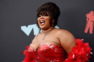 Lizzo In Red Siren Gown Wallpaper