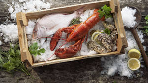 Lobster On Crate Full Of Ice Wallpaper