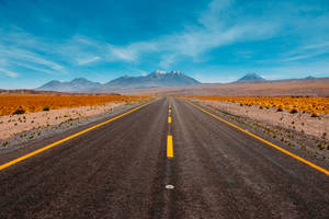 Lone Road Going To Mountains Wallpaper