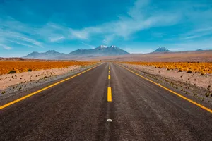Lone Road Going To Mountains Wallpaper