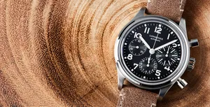 Longines Avigation Bigeye On A Tree Trunk Background Wallpaper