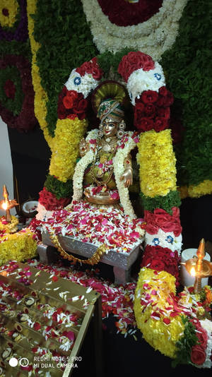 Lord Ayyappa Statue With Garlands Wallpaper