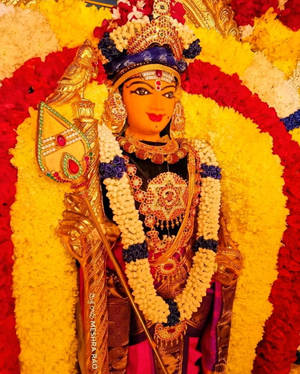 Lord Murugan Adorned With Many Flowers Wallpaper