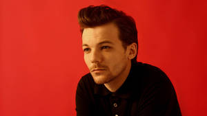 Louis Tomlinson In Black Sweater Wallpaper