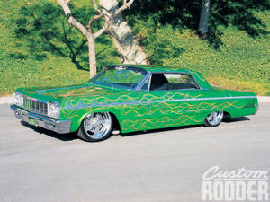 Lowrider Green Impala With Fiery Decals Wallpaper