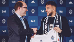 Lucas Cavallini Shaking Hands With Man Wallpaper