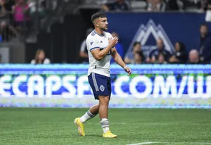 Lucas Cavallini Soccer Player On Field Wallpaper