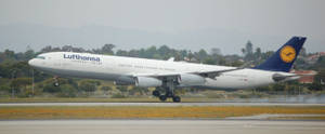 Lufthansa Airplane At The Airport Wallpaper