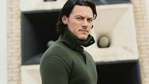 Luke Evans Green Turtle Neck Wallpaper