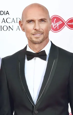 Luke Goss In A Suit And Ribbon Wallpaper