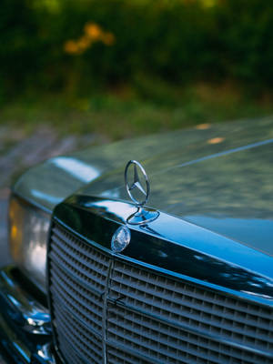 Luxurious Mercedes-benz Front Bumper And Logo Wallpaper