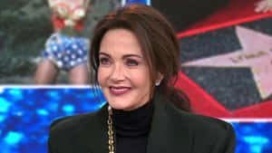 Lynda Carter Smiling During Interview Wallpaper