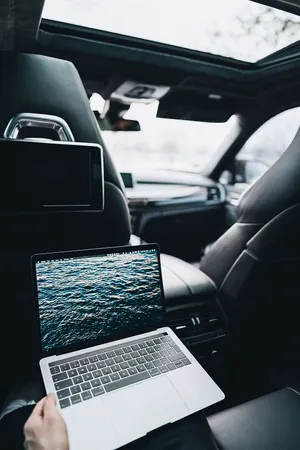 Macbook Air 2020 In A Car Wallpaper