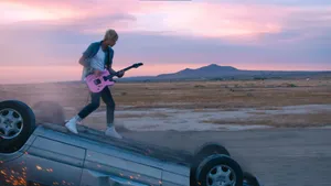 Machine Gun Kelly Over Flipped Car Wallpaper