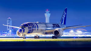 Magnificent Ana Airplane At Night Wallpaper