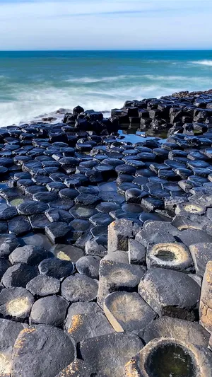 Magnificent View Of Giant's Causeway Against The Blue Ocean Wallpaper