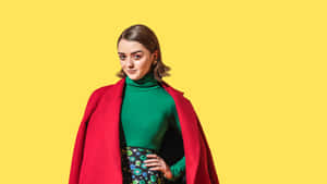 Maisie Williams Posing At A Media Event Wallpaper