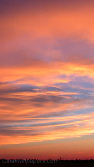 Majestic Clouds Against A Lavender Sky Wallpaper