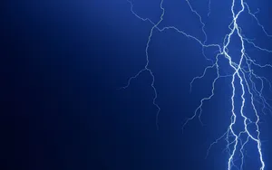 Majestic Cool Lightning Illuminating The Night Sky Wallpaper